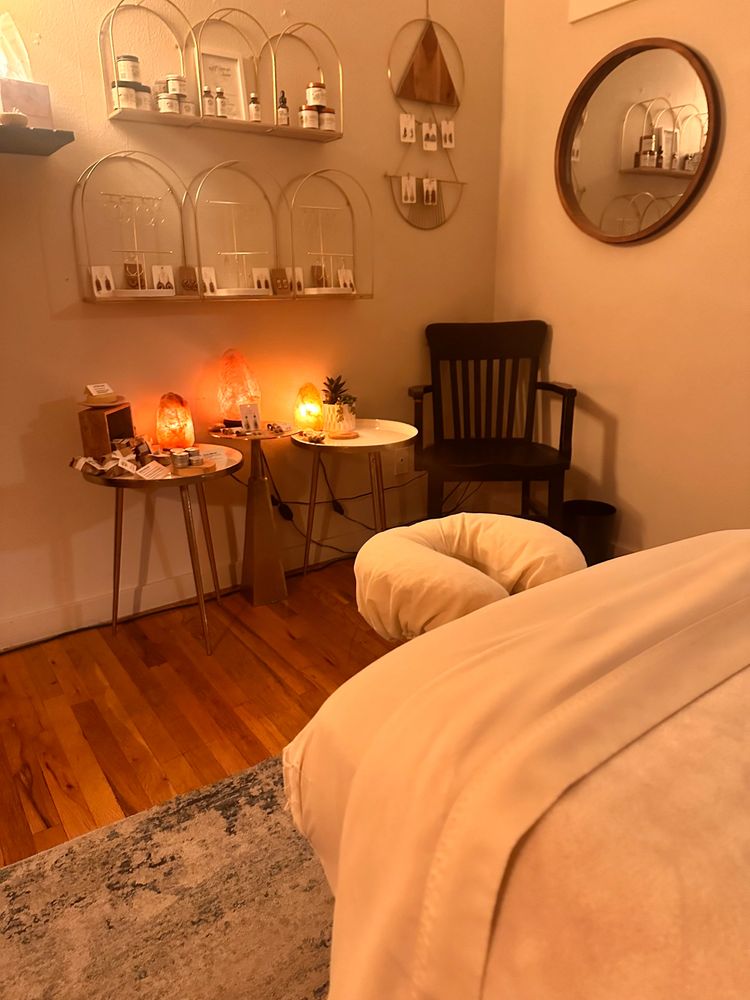 Earthy display of salt lamps, apothecary jars, and handmade goods inside the Idylwild Therapy studio